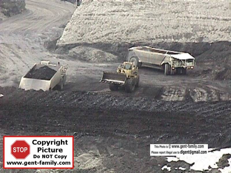 loadingcoalintohaulersbottomofpitshand.jpg