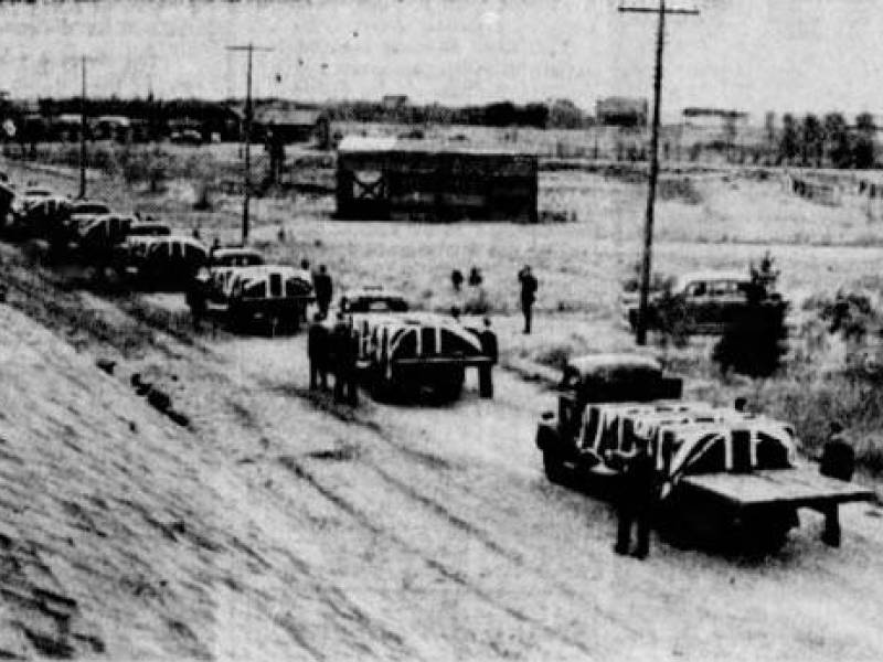 1946funeralprocessioncasketsontrucks.jpg