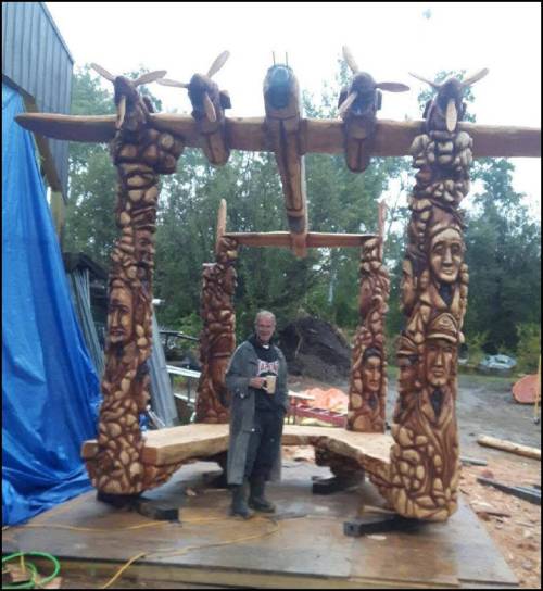 The artist Darren Jones, stands justly proud of his work