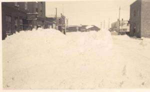 12th ave looking north from 5th st. CPR station in distance, Left (West side)- La Bella Beauty (salon), Mercury Office, Victoria Cafe, on right (east side)- old Creighton Hospital, West Annex, apartment block today, Star Cafe, Bergstrom Hotel
